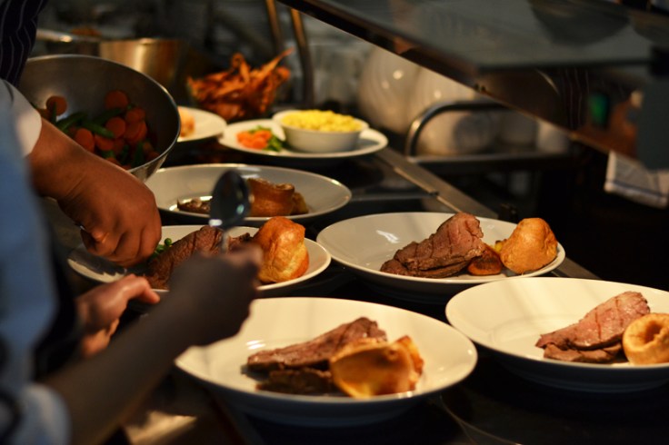 dishing up roast beef vegetables and potatoes